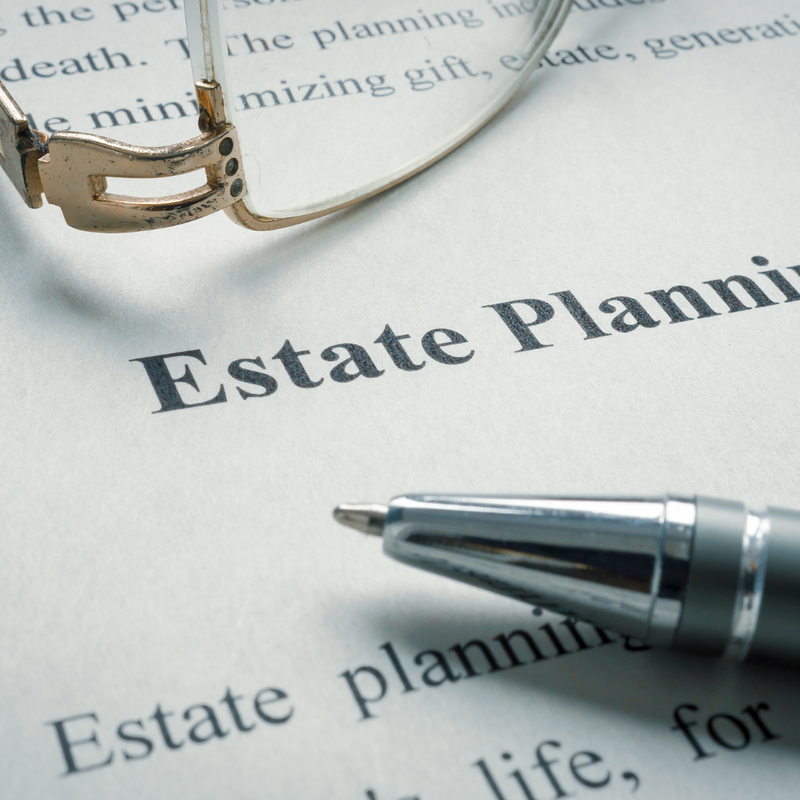 Information about estate planning with glasses and a pen