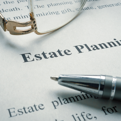 Information about estate planning with glasses and a pen