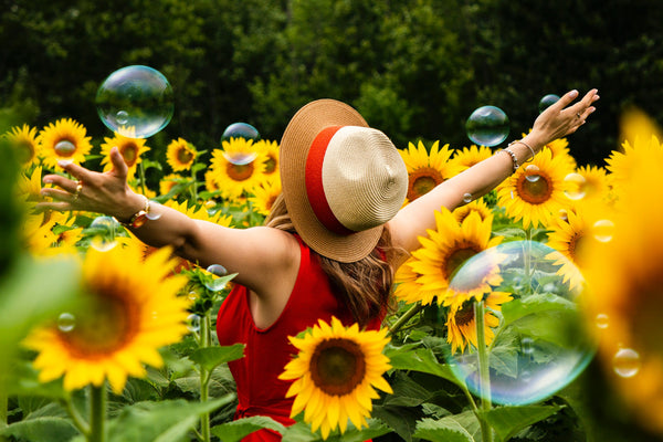 woman-stood-in-sunflower-field